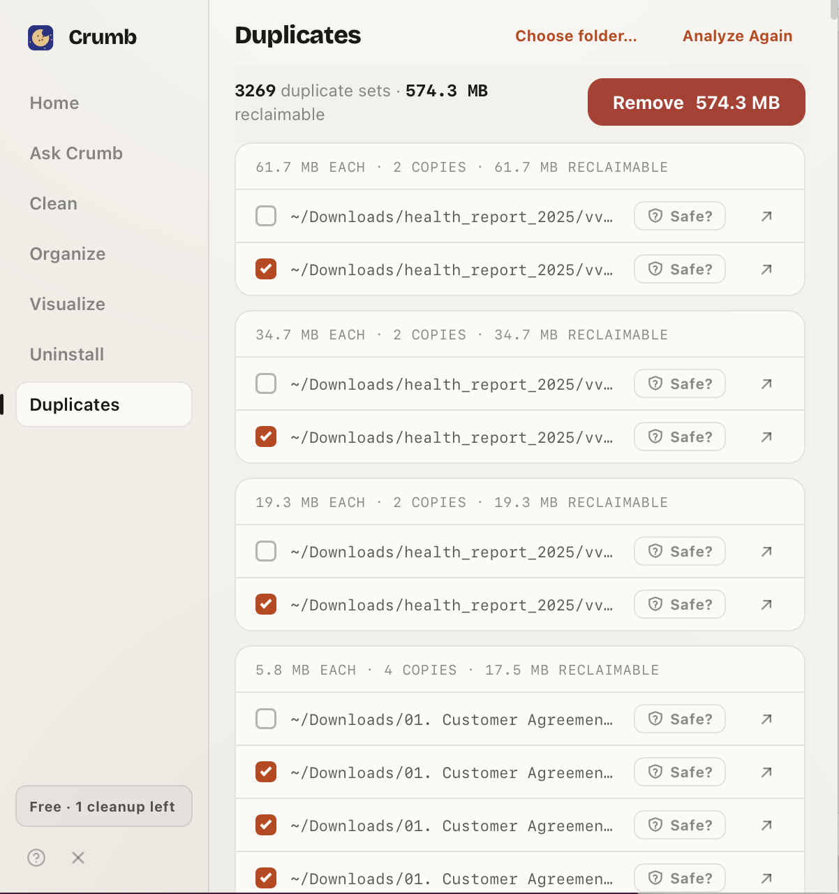 Crumb's Duplicates view listing 3,269 duplicate sets totalling 574.3 MB reclaimable, with a Remove button and duplicate groups that each have a checkbox and a Safe? check.
